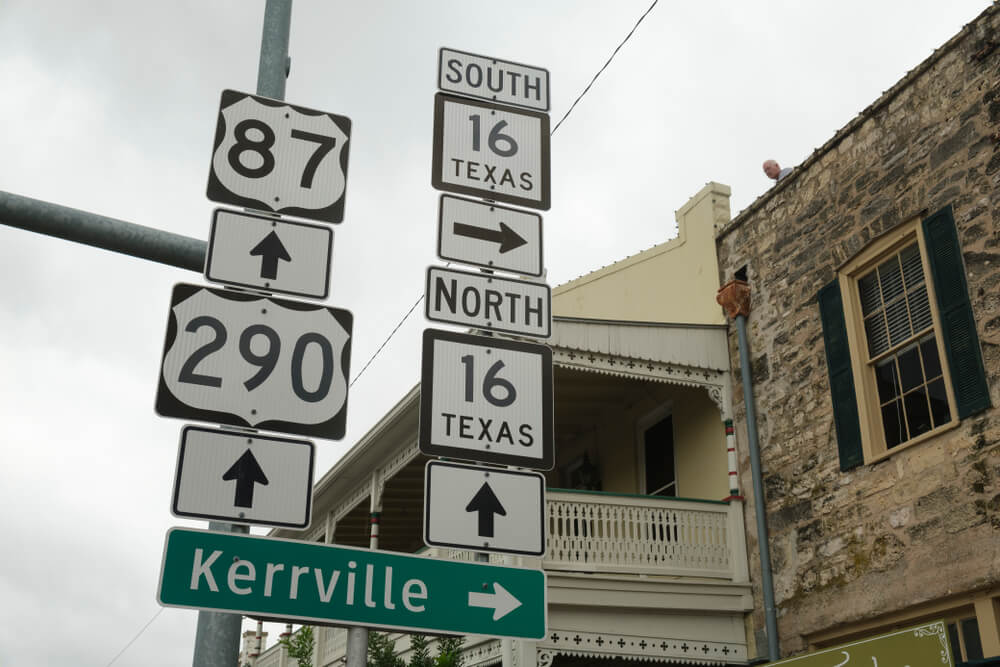 Highway signs along Main Street in San Antonio, Texas.