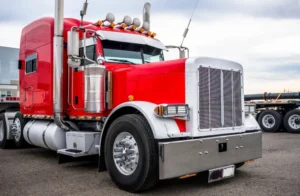 big rig semi truck tractor with chrome accessories and signal horns on the roof